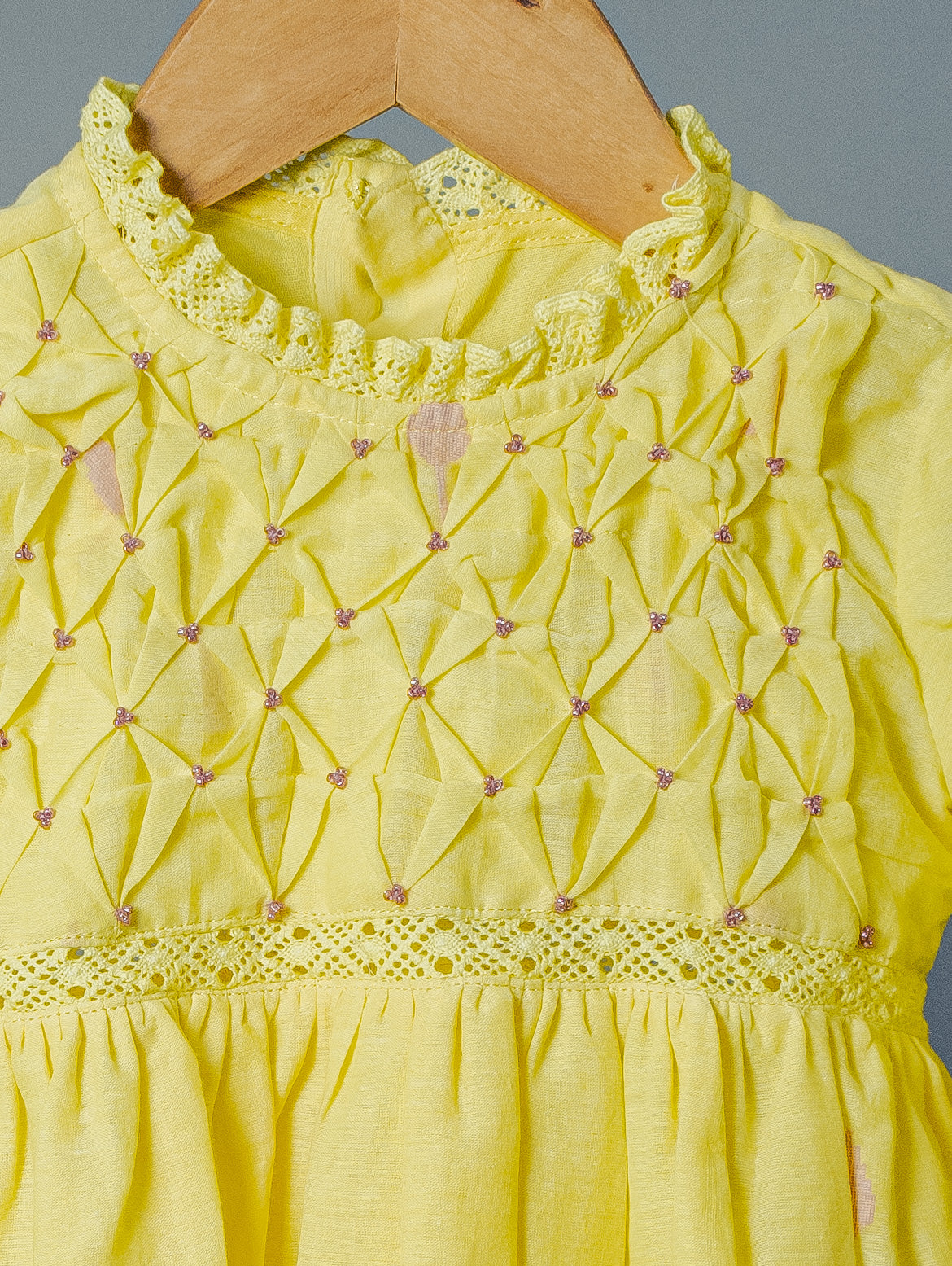 Kids girls yellow cotton jamdani hand smocked dress with beads detail